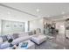 Bright upstairs living room with modern decor, sleek floors and neutral color palette at 10605 Harvest Green Way, Las Vegas, NV 89135