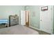 Bedroom featuring neutral walls, a bed, dresser, and a basketball hoop on the door at 10801 Far Country Ave, Las Vegas, NV 89129