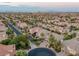 A high-angle view captures a neighborhood with palm-lined streets, well-kept homes, and desert landscaping at 11158 Antonine Wall Ct, Las Vegas, NV 89141