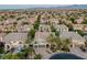 Expansive aerial view of a residential neighborhood showcasing well-maintained homes and lush landscaping at 11158 Antonine Wall Ct, Las Vegas, NV 89141