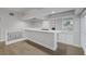 Bar area with modern fixtures, hardwood floors, and white cabinets at 11158 Antonine Wall Ct, Las Vegas, NV 89141