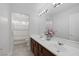 Bathroom featuring a double sink vanity, large mirror and a separate shower-tub combo at 11158 Antonine Wall Ct, Las Vegas, NV 89141