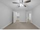 Bedroom boasts neutral carpet, walk-in closet, ceiling fan, and white painted walls at 11158 Antonine Wall Ct, Las Vegas, NV 89141