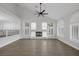 Bright living room with high ceilings, fireplace, and large windows with plantation shutters at 11158 Antonine Wall Ct, Las Vegas, NV 89141