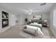 Staged main bedroom includes a fireplace and neutral tones offering a serene retreat at 11158 Antonine Wall Ct, Las Vegas, NV 89141