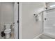 This bathroom offers a toilet and shower with a glass door. There is also a rack for towels next to the shower at 11230 Hidden Peak Ave # 207, Las Vegas, NV 89135