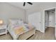 Bedroom featuring wood floors, neutral walls, and a large window with natural light at 11230 Hidden Peak Ave # 207, Las Vegas, NV 89135