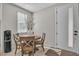 Cozy breakfast nook featuring a round wooden table set and a door to the outside at 11230 Hidden Peak Ave # 207, Las Vegas, NV 89135