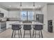 Kitchen featuring stainless steel appliances, island with seating and stylish pendant lighting at 11230 Hidden Peak Ave # 207, Las Vegas, NV 89135