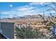 Community view of mountains, blue sky and clouds from the house's patio at 11230 Hidden Peak Ave # 207, Las Vegas, NV 89135