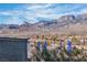 Community view of desert mountains, blue sky and clouds from the house's patio at 11230 Hidden Peak Ave # 207, Las Vegas, NV 89135