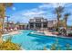 Community pool area with lounge chairs and landscaping. This is a relaxing place for residents to socialize at 11230 Hidden Peak Ave # 207, Las Vegas, NV 89135