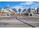 Street view of the community, showcasing palm trees and modern architectural design at 11230 Hidden Peak Ave # 207, Las Vegas, NV 89135