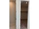 Walk-in closet with a rod for hanging clothes and neutral carpeting at 145 Medianoche St, Las Vegas, NV 89138