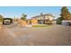 Wide shot of a backyard featuring RV parking, a pool, and a two story home at 200 E Desert Rose Dr, Henderson, NV 89015