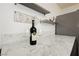 Close-up of marble countertop and beverage on a basement bar at 200 E Desert Rose Dr, Henderson, NV 89015