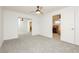 Bright bedroom with carpet, ceiling fan and closet with mirrored sliding doors at 200 E Desert Rose Dr, Henderson, NV 89015