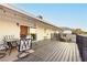 Outdoor deck with a table and chairs, perfect for outdoor dining and enjoying the surrounding views at 200 E Desert Rose Dr, Henderson, NV 89015