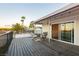 Spacious wooden deck with outdoor seating, offering a relaxing space to enjoy the surrounding landscape at 200 E Desert Rose Dr, Henderson, NV 89015