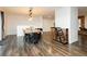 Open-concept dining room with modern lighting and hardwood floors at 200 E Desert Rose Dr, Henderson, NV 89015