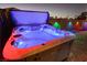 Relaxing hot tub with colorful LED lights and custom hard cover at 200 E Desert Rose Dr, Henderson, NV 89015