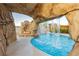 Amazing view of rock waterfall feature into the pool at 200 E Desert Rose Dr, Henderson, NV 89015