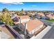 Expansive aerial view of a single-story home with a terra cotta roof, desert landscaping, and views of the Las Vegas valley at 2045 Summit Pointe Dr, Las Vegas, NV 89117