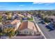 Single-story home features a private backyard with rock landscaping, desert foliage, and a spacious, fenced yard at 2045 Summit Pointe Dr, Las Vegas, NV 89117