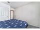 Bright bedroom featuring a turtle-themed comforter, neutral walls, and a closet for storage at 2045 Summit Pointe Dr, Las Vegas, NV 89117