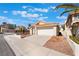 Lovely home with well-kept landscaping, a two-car garage, and a welcoming entrance at 2045 Summit Pointe Dr, Las Vegas, NV 89117