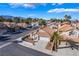 Charming single-story home with a terra cotta roof, desert landscaping, and an attached two-car garage with mountain views at 2045 Summit Pointe Dr, Las Vegas, NV 89117