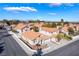 Charming single-story home with a terra cotta roof, desert landscaping, and an attached two-car garage in a gated community at 2045 Summit Pointe Dr, Las Vegas, NV 89117