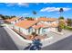 Inviting single-story home boasts a terra cotta roof, low-maintenance desert landscaping, and attached two-car garage at 2045 Summit Pointe Dr, Las Vegas, NV 89117