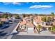 Charming single-story home with a terra cotta roof, desert landscaping, and an attached two-car garage in gated community at 2045 Summit Pointe Dr, Las Vegas, NV 89117