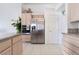 Well-appointed kitchen showcases stainless steel refrigerator and oven with adjacent door at 2045 Summit Pointe Dr, Las Vegas, NV 89117