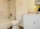 Bright bathroom featuring marble tile surround in shower and large vanity with granite countertops at 221 Mission Newport Ln # 208, Las Vegas, NV 89107