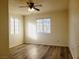 Bedroom with plenty of natural light, ceiling fan, and beautiful hardwood floors at 221 Mission Newport Ln # 208, Las Vegas, NV 89107