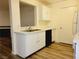 Kitchen featuring stainless steel sink, breakfast bar and laminate countertops at 221 Mission Newport Ln # 208, Las Vegas, NV 89107