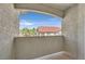 Balcony view overlooking red tile roofs and palm trees against a blue sky at 2305 W Horizon Ridge Pkwy # 3324, Henderson, NV 89052