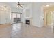 Spacious living room featuring a fireplace, sliding glass doors, and tile flooring at 2305 W Horizon Ridge Pkwy # 3324, Henderson, NV 89052