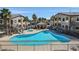 Large community pool and hot tub surrounded by lounge chairs at 2305 W Horizon Ridge Pkwy # 3324, Henderson, NV 89052