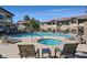 Community pool and hot tub area surrounded by lounge chairs and greenery at 2305 W Horizon Ridge Pkwy # 3324, Henderson, NV 89052