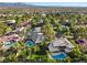 Wonderful aerial view of home with a private pool and a nicely landscaped backyard with large mature trees at 2309 Prometheus Ct, Henderson, NV 89074