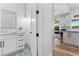 Bright bathroom with blue tile and marble countertops next to breakfast nook at 2309 Prometheus Ct, Henderson, NV 89074