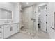 Bright bathroom features modern vanity, a spacious glass enclosed shower, and neutral tile at 2309 Prometheus Ct, Henderson, NV 89074