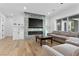 Stylish living room with modern fireplace and hardwood floors at 2309 Prometheus Ct, Henderson, NV 89074