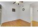 Dining area with hardwood floors, modern ceiling fan, wall decor and an open doorway to the bathroom at 231 W Horizon Ridge Pkwy # 2413, Henderson, NV 89012