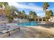 Resort-style swimming pool with sundeck and lounge chairs under blue skies at 231 W Horizon Ridge Pkwy # 2413, Henderson, NV 89012