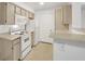 Well-lit kitchen featuring ample cabinet space and modern white appliances at 231 W Horizon Ridge Pkwy # 527, Henderson, NV 89012