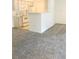 The cozy living room features neutral carpeting and a half-wall that separates the living area from the kitchen at 231 W Horizon Ridge Pkwy # 527, Henderson, NV 89012